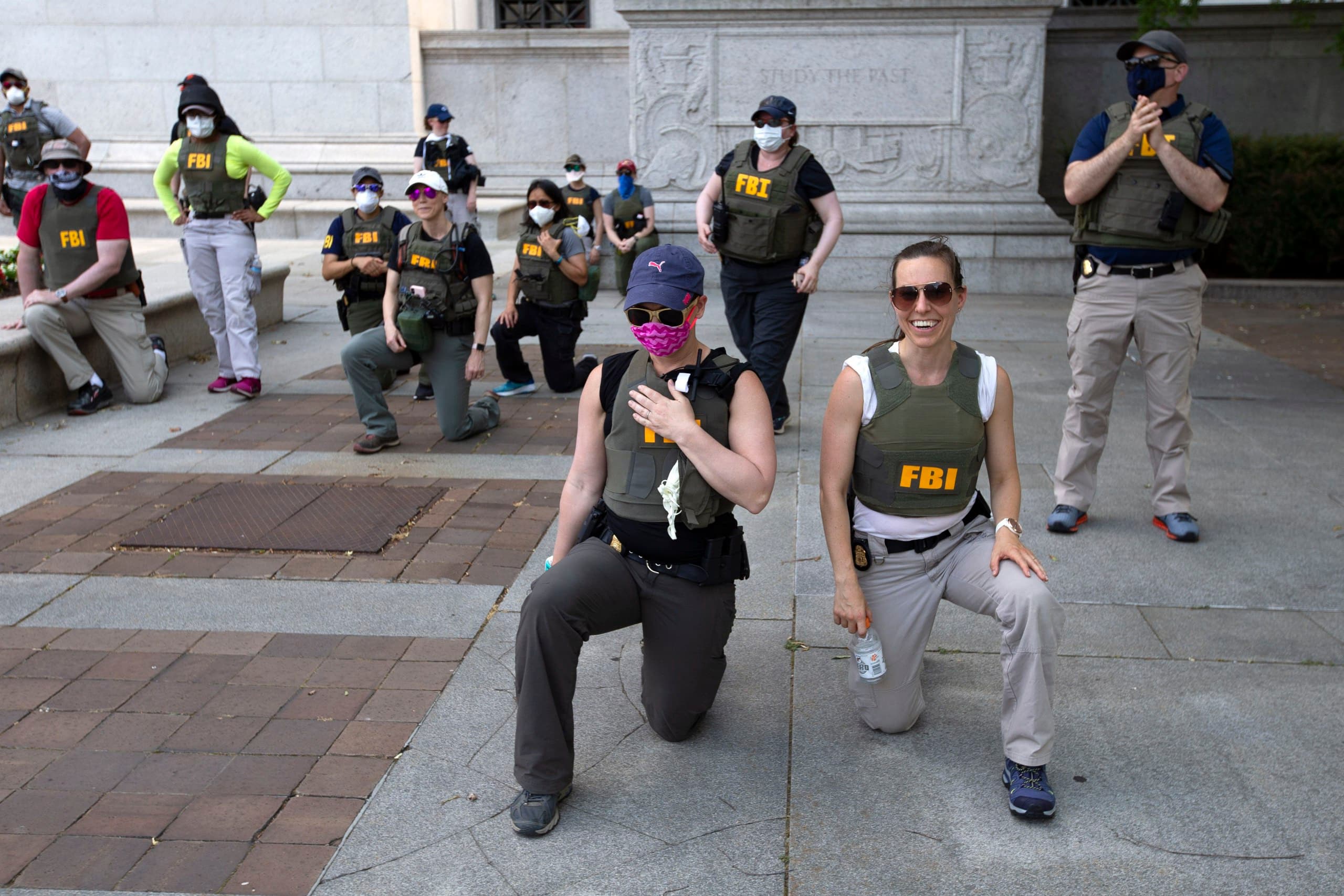 Featured image for: FBI fires agents photographed kneeling during 2020 protest FBI fires agents photographed kneeling during 2020 protest