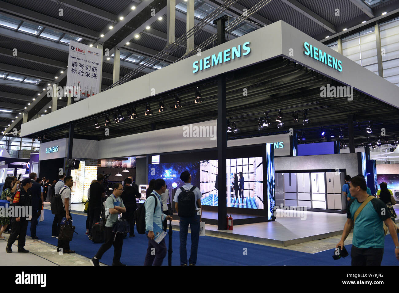 FILE--People visit the stand of Siemens during the second ...