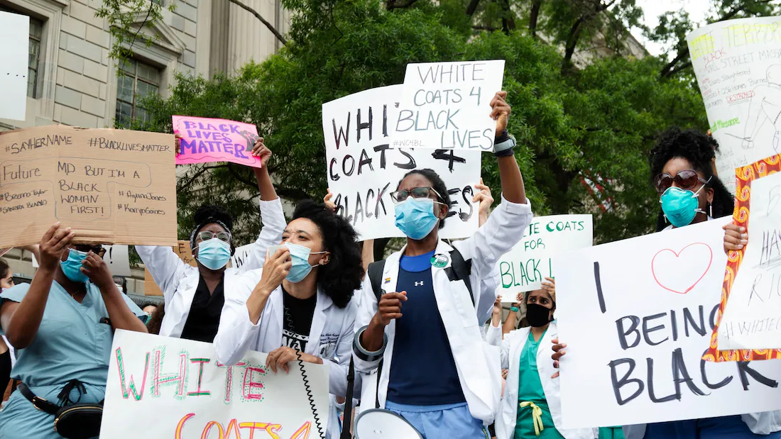 Health-care workers in white coats join D.C. protests