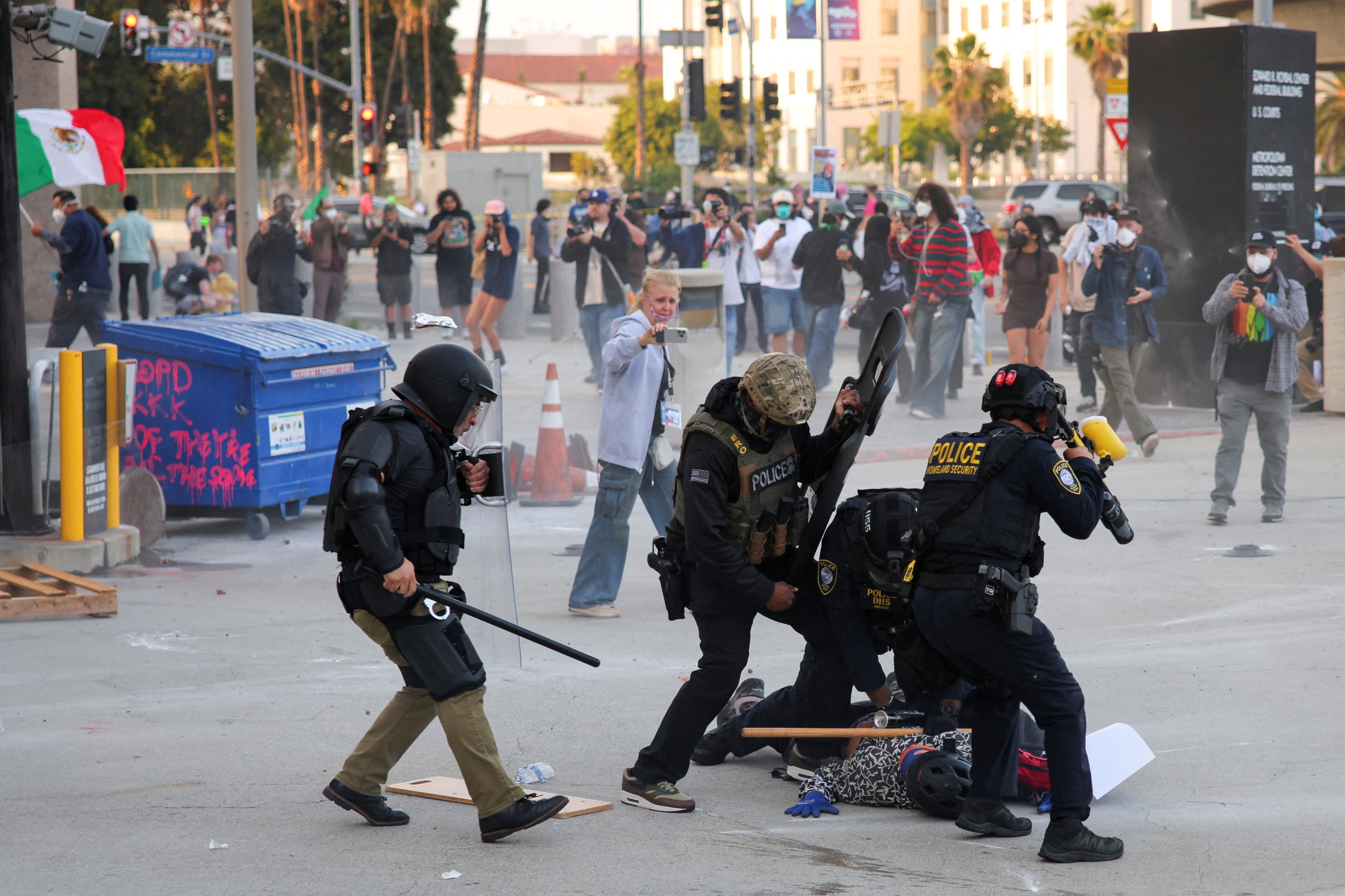 Riot police, anti-ICE protesters square off in Los Angeles ...