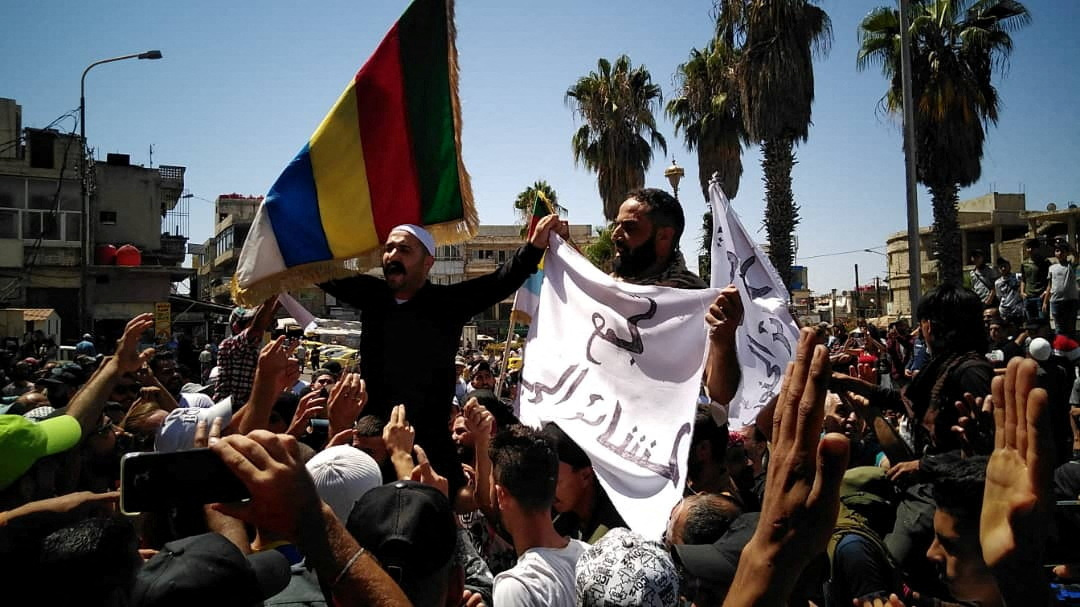 Protests hit Druze city in Syria for fifth day | Reuters