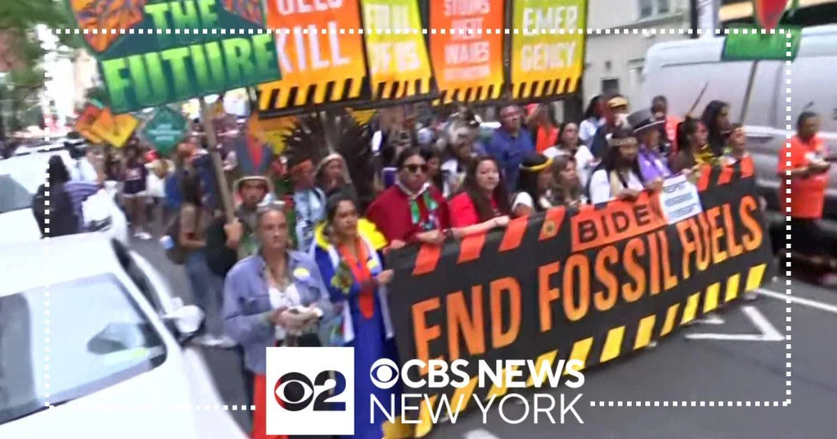 Tens of thousands of anti-fossil fuel protesters march in Midtown - CBS ...